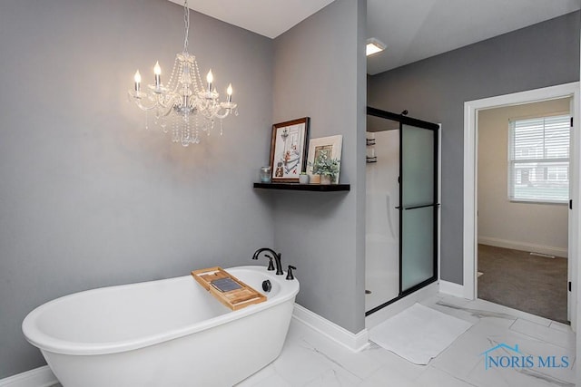 bathroom with shower with separate bathtub and a notable chandelier