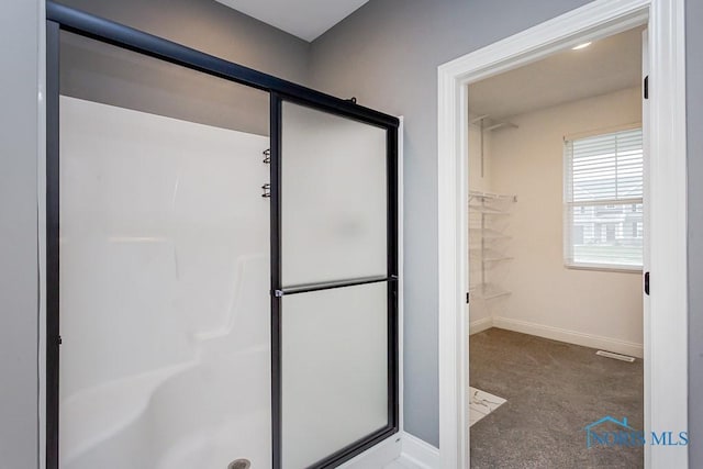 bathroom featuring walk in shower