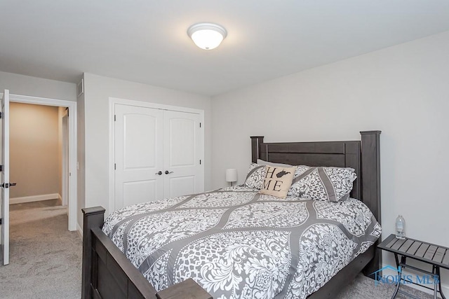 carpeted bedroom with a closet