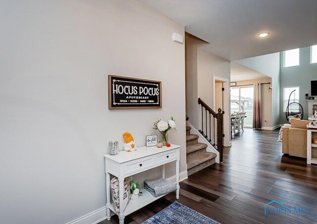 hall with dark hardwood / wood-style floors