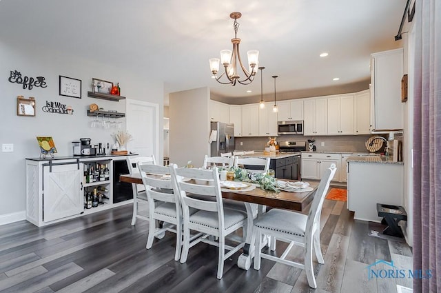 dining space featuring a notable chandelier and dark wood-type flooring