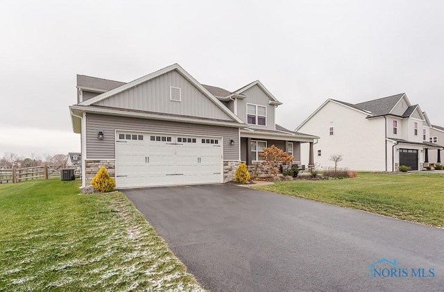 view of front of home featuring central AC unit and a front lawn