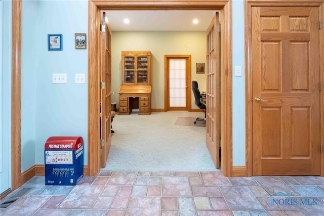 hallway with carpet flooring