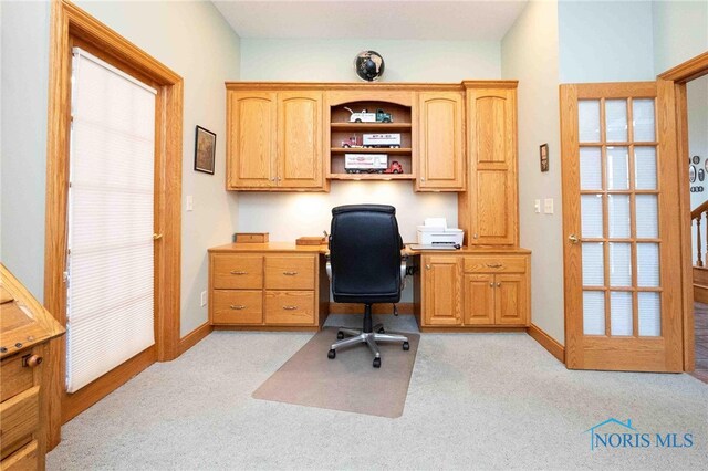 home office featuring light colored carpet