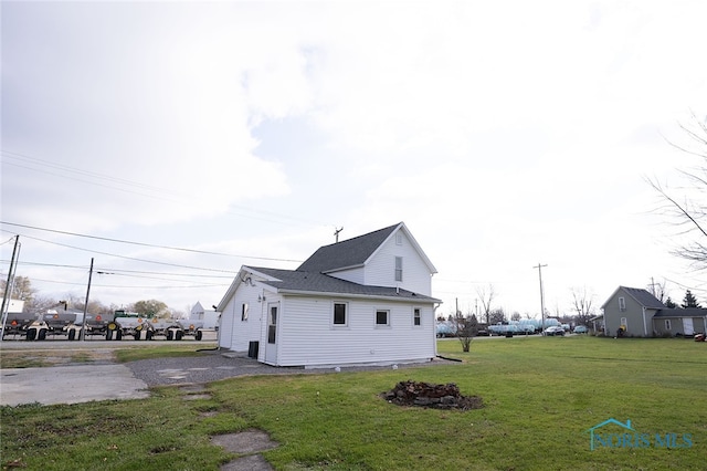 view of home's exterior featuring a yard