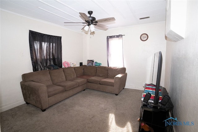 living room featuring carpet flooring, ceiling fan, and crown molding