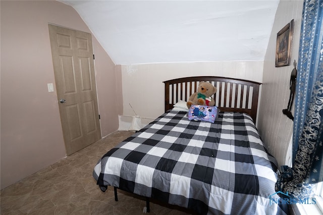 bedroom with lofted ceiling