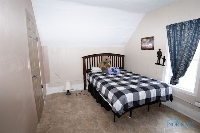 bedroom featuring lofted ceiling