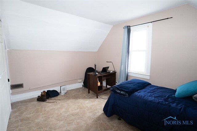 bedroom with vaulted ceiling