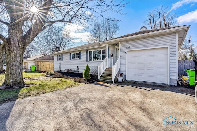 single story home featuring a garage