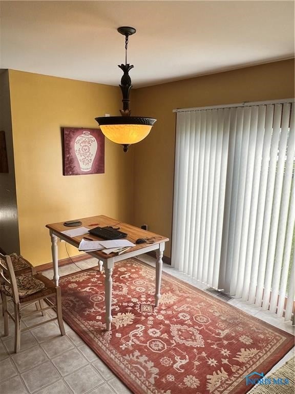 tiled dining area with a healthy amount of sunlight