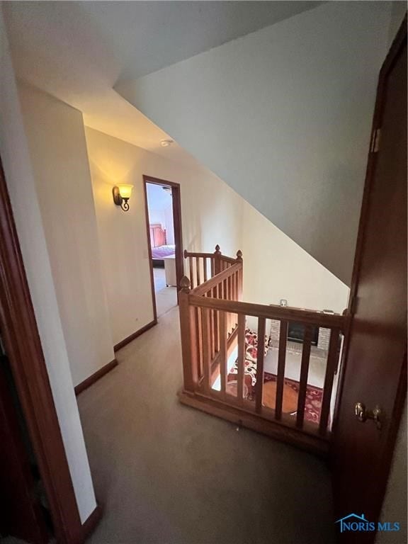 hall featuring light colored carpet