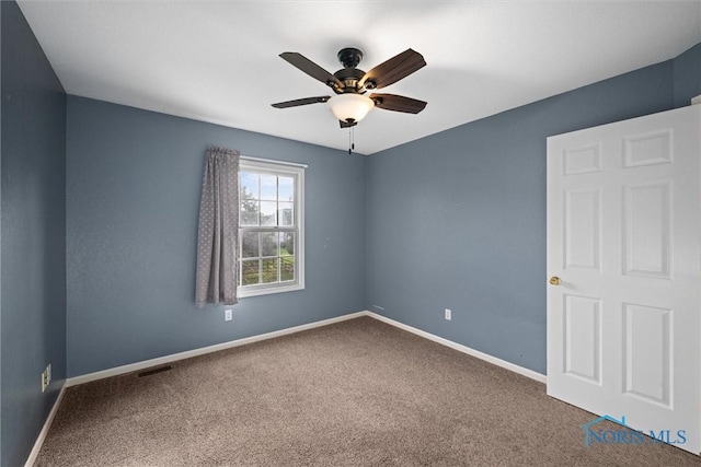 unfurnished room featuring carpet flooring and ceiling fan