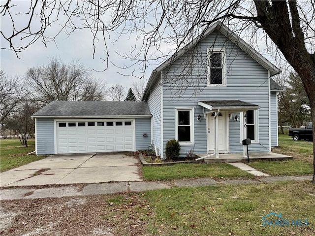 front of property with a garage and a front lawn