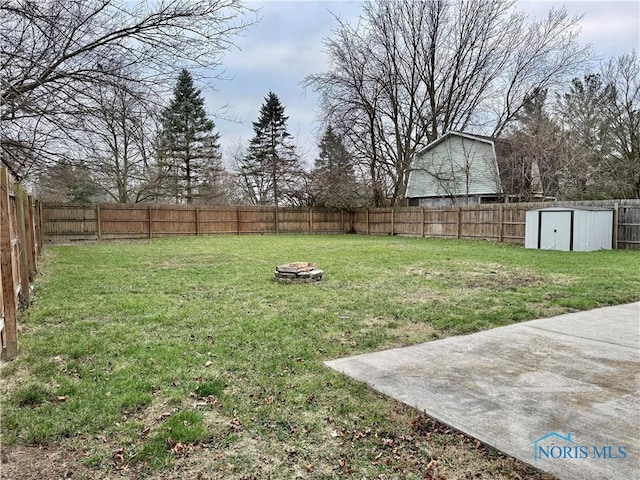 view of yard featuring a patio and an outdoor fire pit