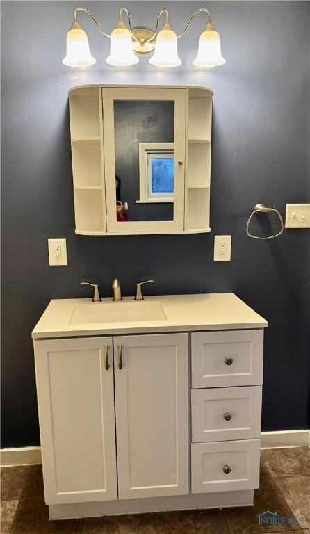 bathroom with tile patterned flooring and vanity