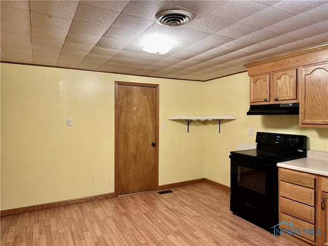 kitchen featuring light wood-type flooring and black range with electric stovetop