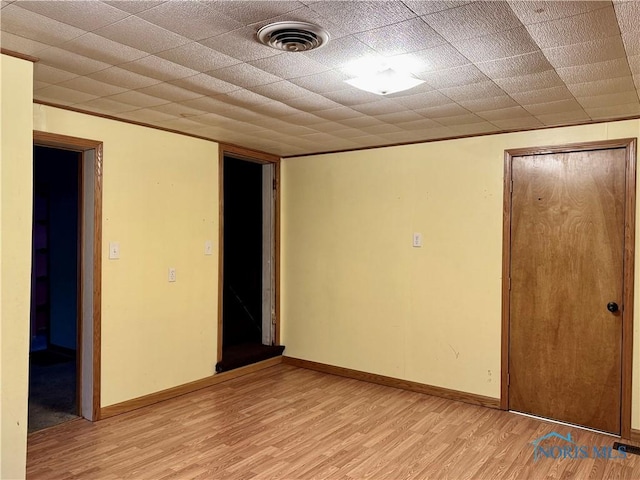 unfurnished room with light wood-type flooring