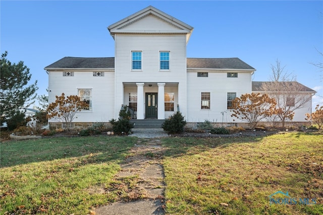 view of front facade featuring a porch and a front yard