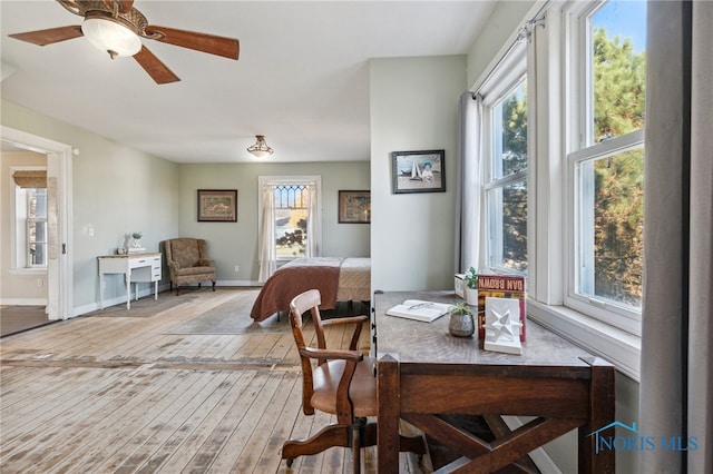 dining area featuring hardwood / wood-style flooring and ceiling fan