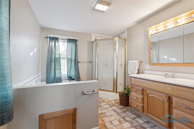 bathroom featuring vanity and a shower with door