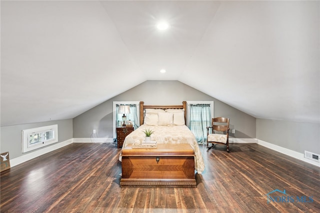 bedroom with dark wood-type flooring and vaulted ceiling