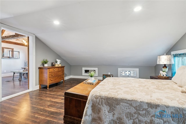 bedroom featuring dark hardwood / wood-style floors and lofted ceiling