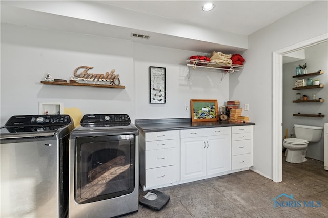 laundry area with independent washer and dryer