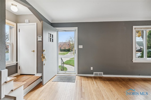 foyer entrance with light wood-type flooring