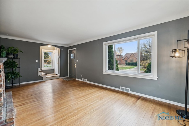 interior space featuring light wood-type flooring and a fireplace