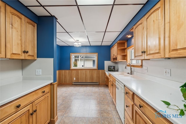 kitchen with a paneled ceiling, an inviting chandelier, white dishwasher, sink, and baseboard heating