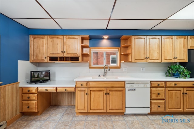 kitchen featuring a paneled ceiling, a baseboard heating unit, sink, dishwasher, and wood walls