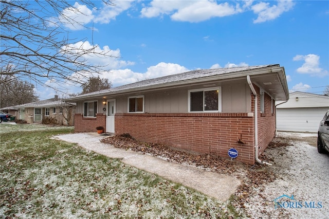 view of front of property with an outbuilding and a garage