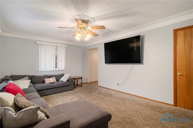 carpeted living room featuring ceiling fan, a textured ceiling, and ornamental molding