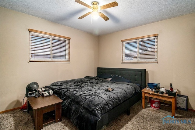 bedroom with carpet flooring, ceiling fan, a textured ceiling, and multiple windows