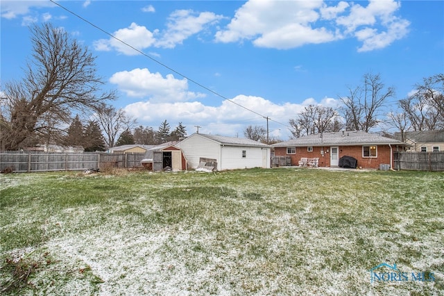 back of property with a lawn