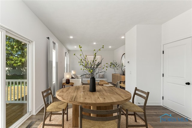 dining space featuring dark hardwood / wood-style floors