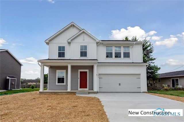 view of front of home featuring covered porch and a garage