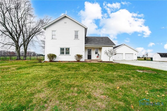 view of front of house featuring a garage and a front yard