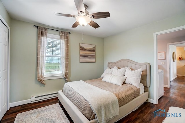 bedroom featuring dark wood-type flooring, ceiling fan, a baseboard radiator, and a closet