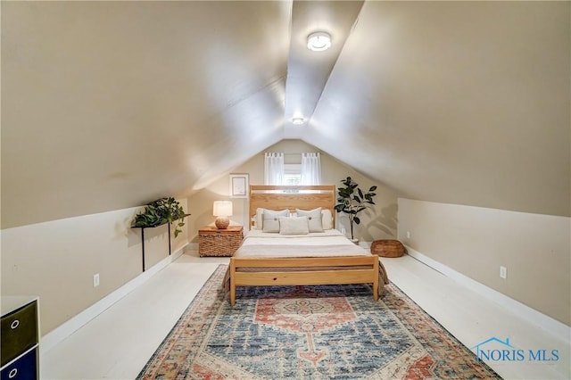 bedroom with lofted ceiling