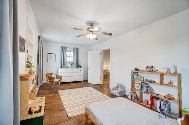 bedroom featuring ceiling fan and dark hardwood / wood-style floors