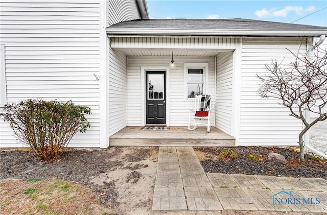 entrance to property featuring a porch