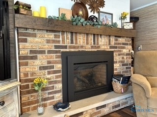 interior details featuring a brick fireplace