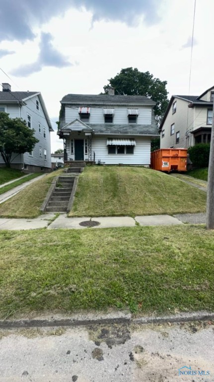 view of front of home with a front yard