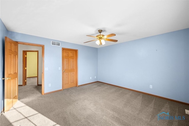 unfurnished bedroom featuring ceiling fan and carpet floors