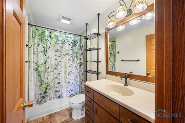 full bathroom with vanity, toilet, ornamental molding, and shower / tub combo