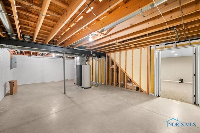 basement featuring gas water heater and electric panel