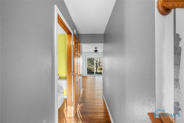 corridor featuring hardwood / wood-style flooring