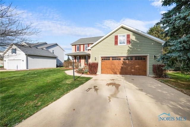 view of front of house with a front lawn and a garage